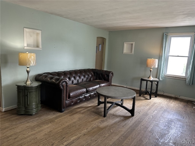 504 Allen Rd, Clay, NY 13212 - living room featuring arched walkways and wood finished floors