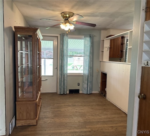 504 Allen Rd, Clay, NY 13212 - unfurnished dining area with ceiling fan and dark wood-style flooring