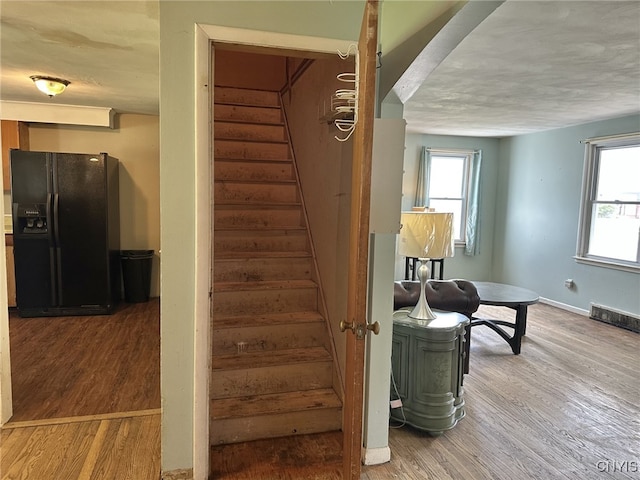 504 Allen Rd, Clay, NY 13212 - staircase featuring wood finished floors and baseboards