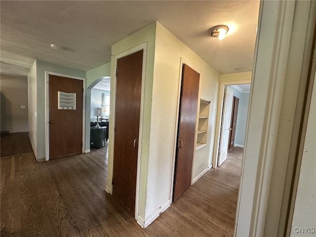 504 Allen Rd, Clay, NY 13212 - corridor with dark wood-style floors and arched walkways