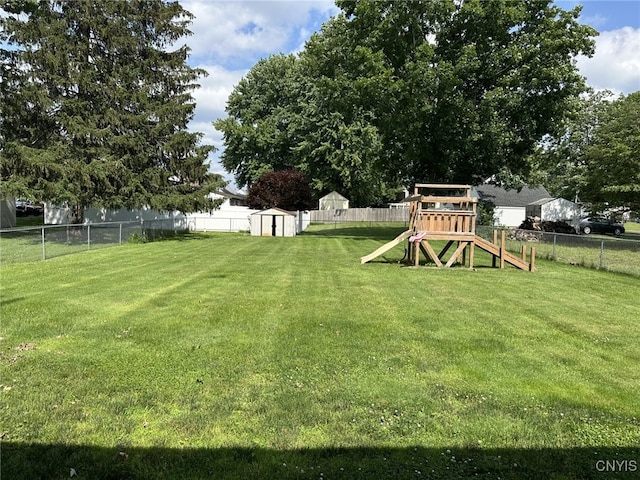 504 Allen Rd, Clay, NY 13212 - fenced backyard with a playground and a storage unit