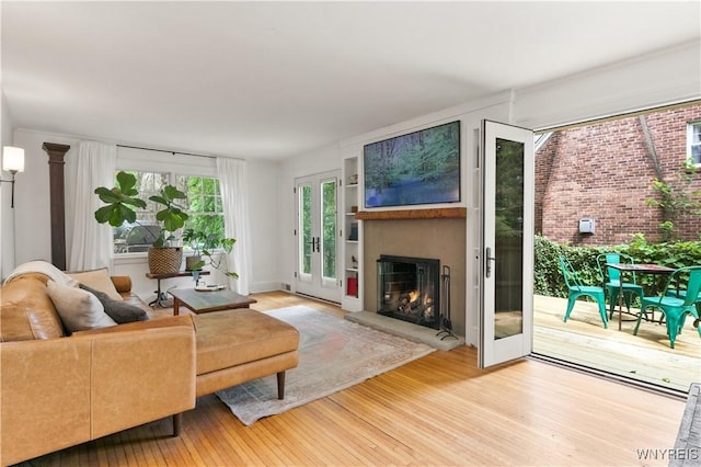 90 Koster, Amherst, NY 14226 - living area featuring wood finished floors and a lit fireplace