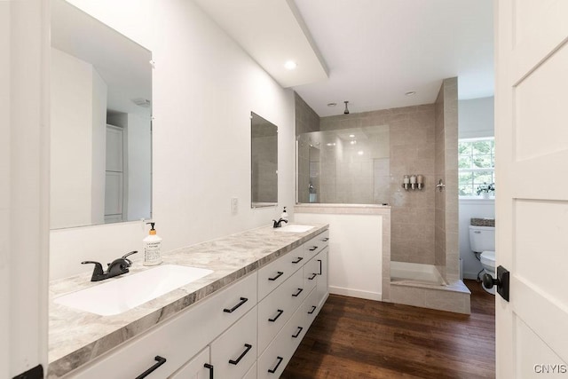 2178 Conley Rd, Sullivan, NY 13037 - bathroom featuring double vanity, walk in shower, and wood finished floors