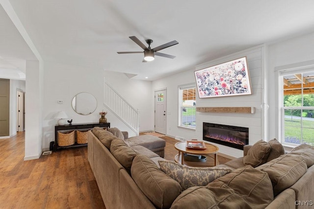 2178 Conley Rd, Sullivan, NY 13037 - living room with stairway, wood finished floors, ceiling fan, a large fireplace, and recessed lighting