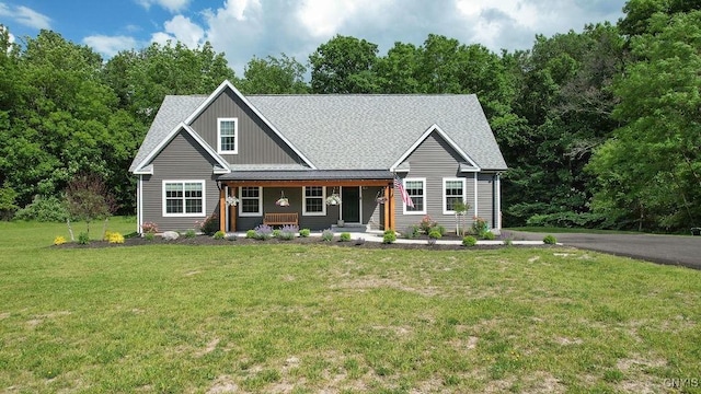 2178 Conley Rd, Sullivan, NY 13037 - view of front facade featuring a porch, a front lawn, and roof with shingles