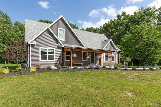 2178 Conley Rd, Sullivan, NY 13037 - view of front of house featuring board and batten siding, a shingled roof, covered porch, and a front yard