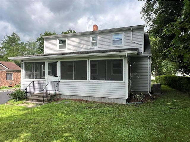 100 Curren Dr, Elmira, NY 14905 - view of front of house featuring a sunroom, a chimney, a front lawn, and roof with shingles