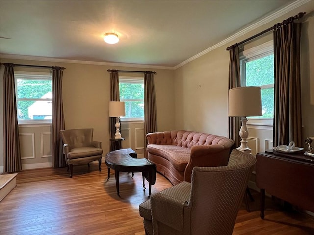 100 Curren Dr, Elmira, NY 14905 - living room featuring light wood finished floors, healthy amount of natural light, and ornamental molding