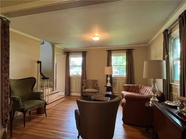 100 Curren Dr, Elmira, NY 14905 - living area with healthy amount of natural light, wood finished floors, ornamental molding, and stairs