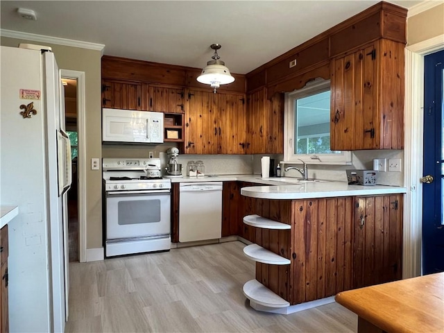 100 Curren Dr, Elmira, NY 14905 - kitchen with white appliances, light countertops, crown molding, light wood-style flooring, and a peninsula