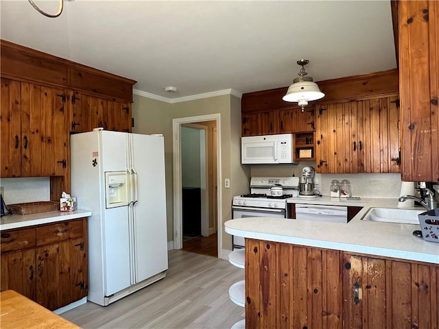 100 Curren Dr, Elmira, NY 14905 - kitchen featuring white appliances, brown cabinetry, light wood-style floors, and ornamental molding