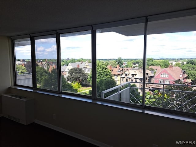 1088 Delaware Ave Unit 6C, Buffalo, NY 14209 - unfurnished room featuring a residential view and radiator
