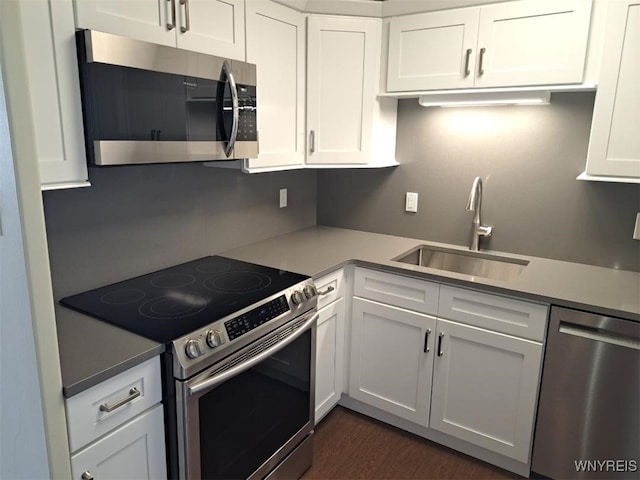 1088 Delaware Ave Unit 6C, Buffalo, NY 14209 - kitchen featuring stainless steel appliances, white cabinets, dark wood finished floors, and light countertops
