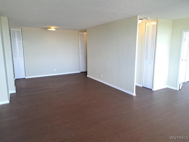 1088 Delaware Ave Unit 6C, Buffalo, NY 14209 - empty room featuring dark wood finished floors and a textured ceiling