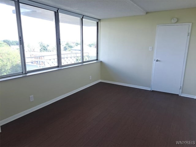 1088 Delaware Ave Unit 6C, Buffalo, NY 14209 - unfurnished room featuring dark wood-style floors and a smoke detector