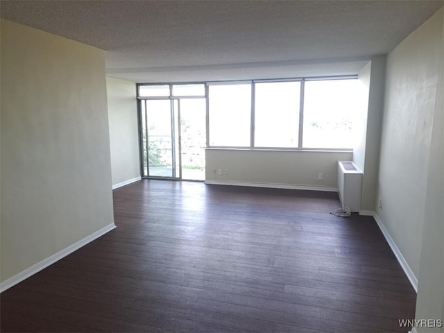 1088 Delaware Ave Unit 6C, Buffalo, NY 14209 - unfurnished room featuring radiator and dark wood-style floors