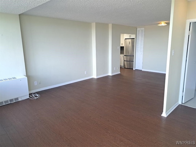 1088 Delaware Ave Unit 6C, Buffalo, NY 14209 - unfurnished room featuring dark wood-style floors and a textured ceiling