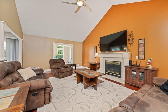 203 Torrey Pine Dr, Greece, NY 14612 - living room with a ceiling fan, wood finished floors, a fireplace with flush hearth, and high vaulted ceiling