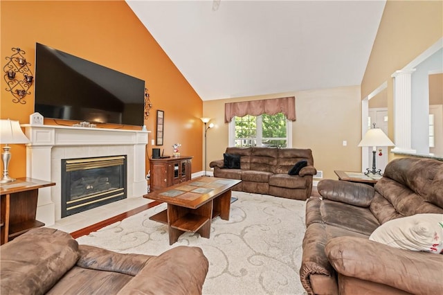 203 Torrey Pine Dr, Greece, NY 14612 - living area with high vaulted ceiling, a tile fireplace, wood finished floors, and ornate columns