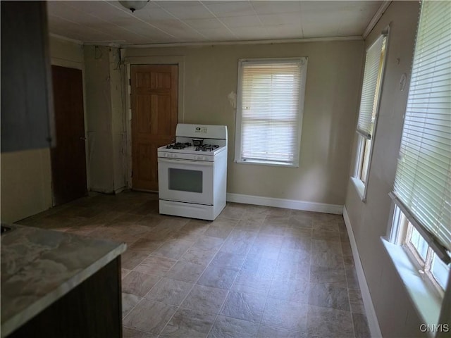 1026 Hess Ln, Utica, NY 13502 - kitchen featuring white range with gas stovetop and ornamental molding