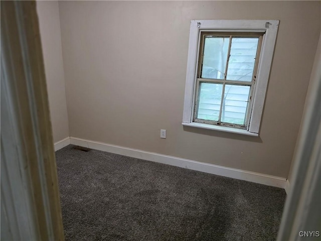 1026 Hess Ln, Utica, NY 13502 - empty room featuring dark carpet and baseboards