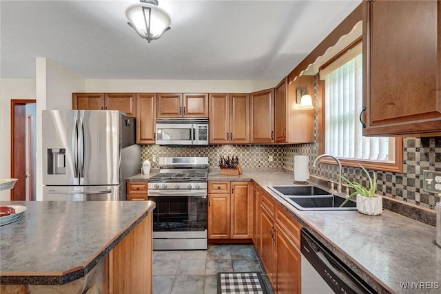 3735 County Road 34, Wirt, NY 14739 - kitchen with stainless steel appliances, backsplash, brown cabinets, and dark countertops
