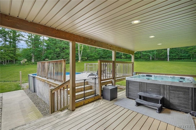 3735 County Road 34, Wirt, NY 14739 - deck with a hot tub, a yard, and view of wooded area