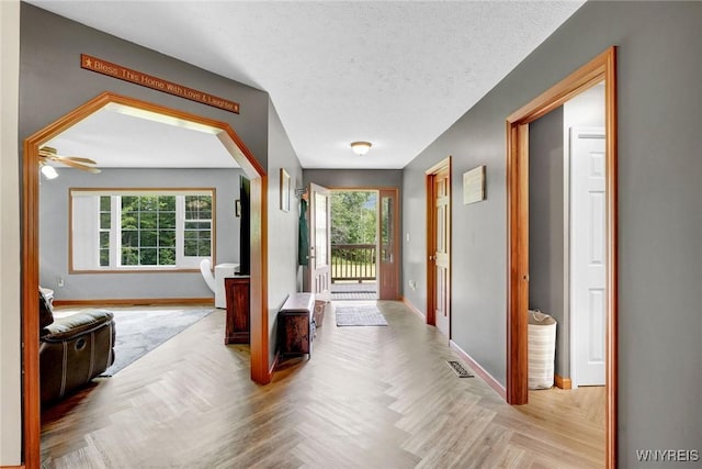 3735 County Road 34, Wirt, NY 14739 - hallway featuring plenty of natural light and a textured ceiling