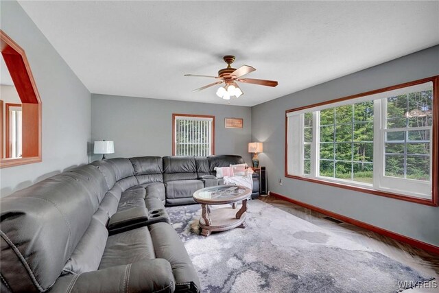 3735 County Road 34, Wirt, NY 14739 - living room featuring a ceiling fan and wood finished floors