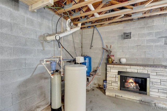 3735 County Road 34, Wirt, NY 14739 - basement featuring a water softener, a glass covered fireplace, and a water pressure tank