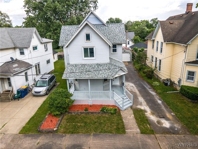 187 Lock St, Lockport-City, NY 14094 - view of front of home featuring a shingled roof, a porch, driveway, and a front lawn