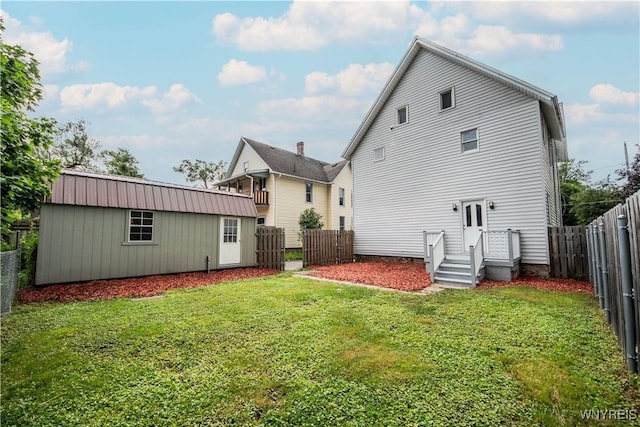 187 Lock St, Lockport-City, NY 14094 - back of property with a fenced backyard and an outbuilding