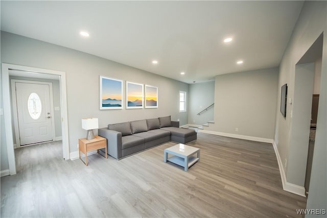 187 Lock St, Lockport-City, NY 14094 - living room with stairway, wood finished floors, and recessed lighting