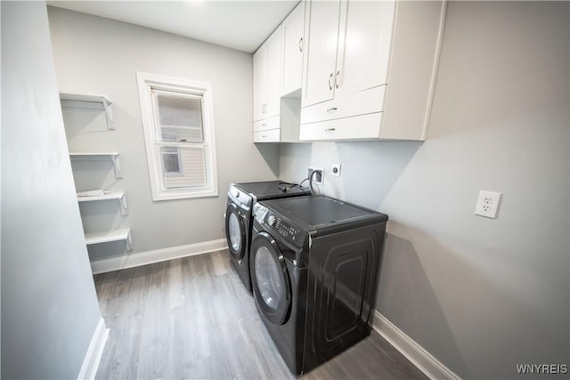 187 Lock St, Lockport-City, NY 14094 - laundry area with cabinet space, dark wood-style floors, and washing machine and clothes dryer