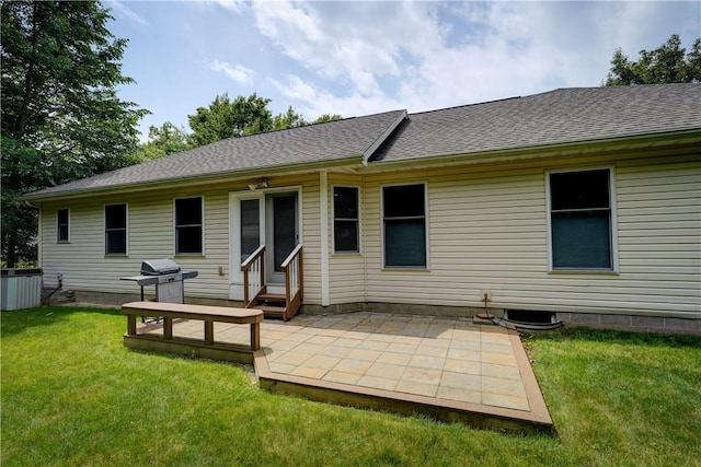 40 Little Glen Rd, Henrietta, NY 14534 - rear view of house with entry steps, a lawn, a patio, and a shingled roof