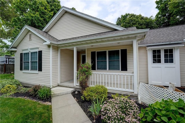 40 Little Glen Rd, Henrietta, NY 14534 - view of front facade with a porch and a shingled roof