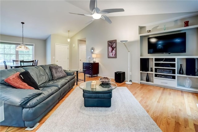 40 Little Glen Rd, Henrietta, NY 14534 - living area with vaulted ceiling, wood finished floors, a ceiling fan, and built in shelves