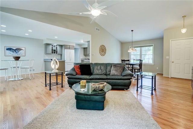 40 Little Glen Rd, Henrietta, NY 14534 - living room featuring ceiling fan, lofted ceiling, and light wood-style flooring