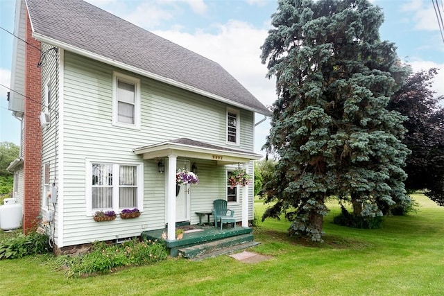 9094 W Henrietta Rd, Rush, NY 14472 - back of property featuring a lawn, covered porch, and a shingled roof