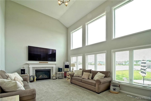 5472 Sycamore Ln, Hamburg, NY 14075 - carpeted living area with a tile fireplace and high vaulted ceiling