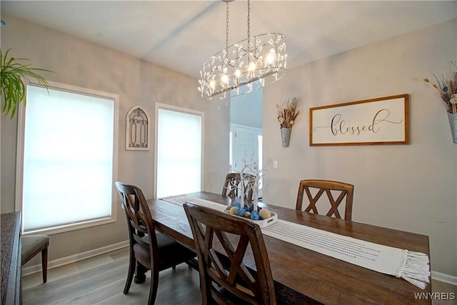 5472 Sycamore Ln, Hamburg, NY 14075 - dining room with a chandelier and wood finished floors