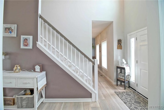 5472 Sycamore Ln, Hamburg, NY 14075 - entrance foyer featuring stairway, wood finished floors, and a towering ceiling