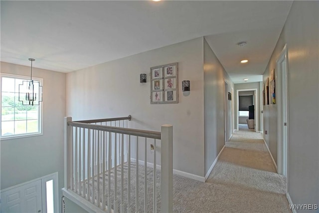 5472 Sycamore Ln, Hamburg, NY 14075 - corridor featuring an upstairs landing, carpet flooring, a chandelier, and recessed lighting