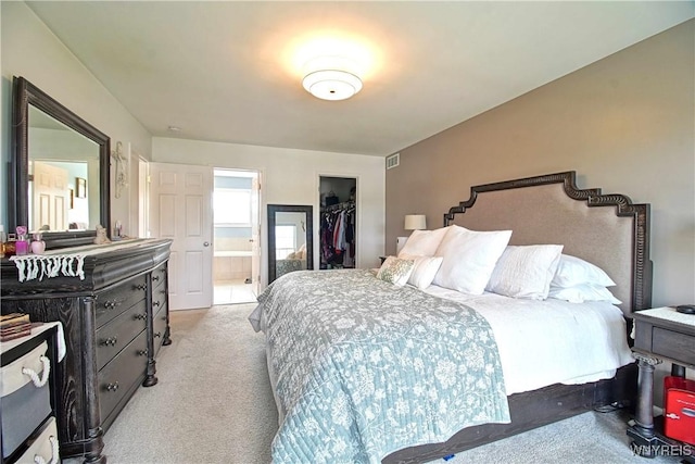 5472 Sycamore Ln, Hamburg, NY 14075 - bedroom featuring light colored carpet, a spacious closet, connected bathroom, and a closet