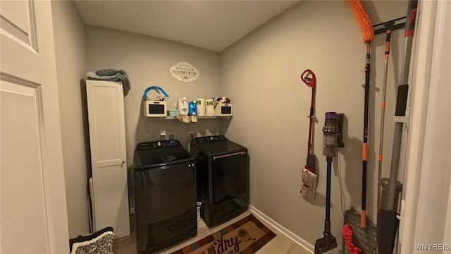5472 Sycamore Ln, Hamburg, NY 14075 - laundry room with washer and clothes dryer and cabinet space