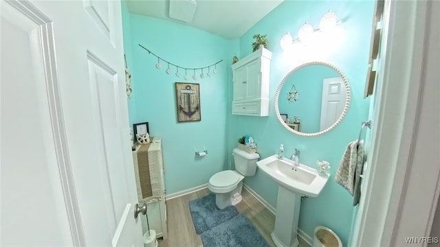 5472 Sycamore Ln, Hamburg, NY 14075 - half bath featuring wood finished floors and toilet