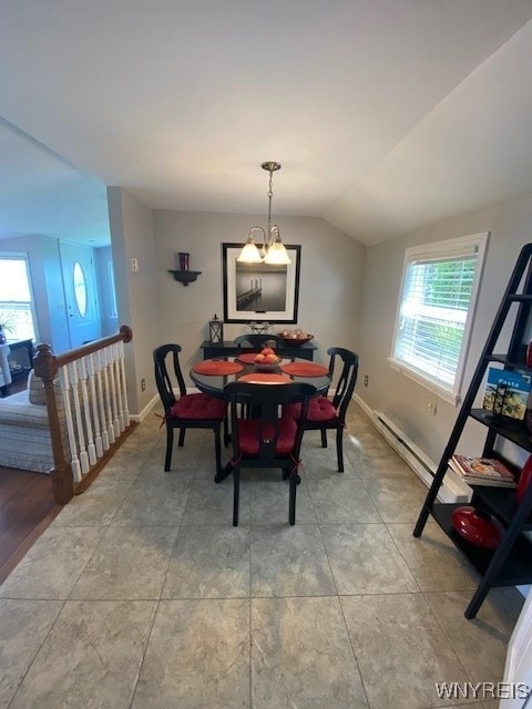 4192 Upson Point Rd, Starkey, NY 14837 - dining room featuring plenty of natural light, lofted ceiling, and a chandelier