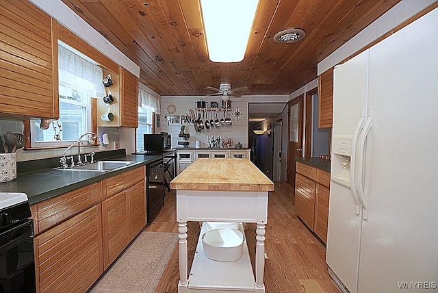 3042 Baseline Rd, Grand Island, NY 14072 - kitchen with black appliances, light wood finished floors, butcher block counters, wooden ceiling, and a kitchen island