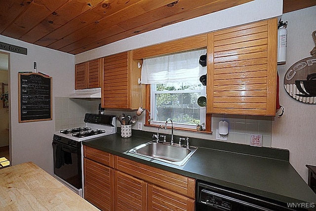 3042 Baseline Rd, Grand Island, NY 14072 - kitchen with white range with gas cooktop, under cabinet range hood, brown cabinets, decorative backsplash, and dark countertops