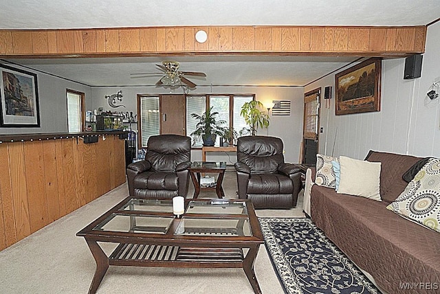 3042 Baseline Rd, Grand Island, NY 14072 - carpeted living room with a ceiling fan and wooden walls